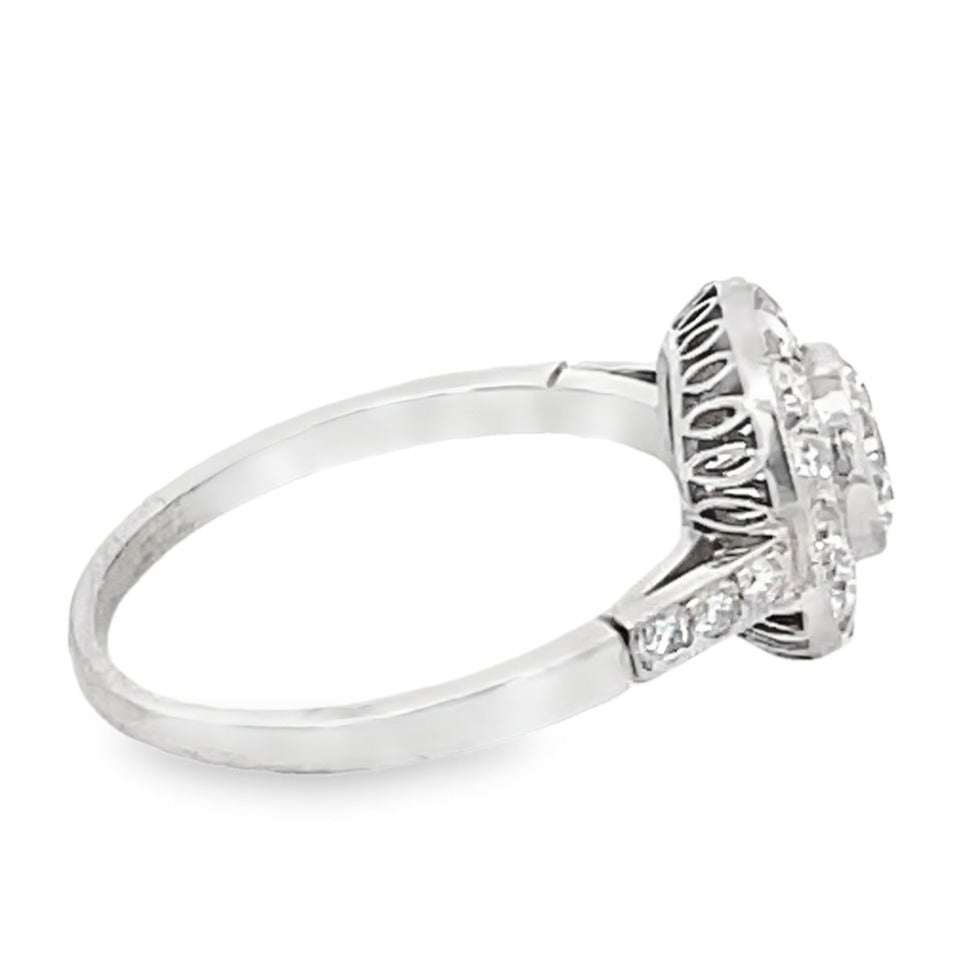 Side view of 0.65ct Round Brilliant Cut Diamond Engagement Ring, Diamond Halo, Platinum