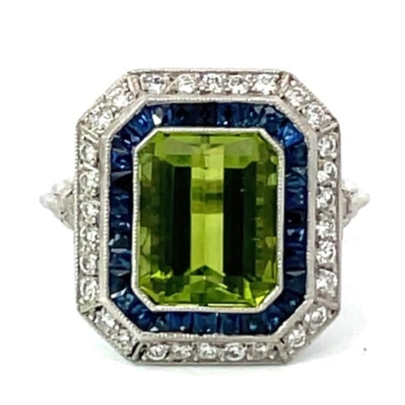 Front view of 3.77ct Emerald Cut Peridot Cocktail Ring, Diamond & Sapphire Halo, Platinum