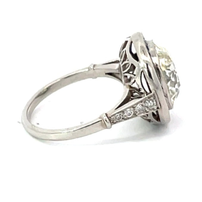 Side view of 5.15ct Antique Cushion Cut Diamond Engagement Ring, Sapphire Halo, Platinum