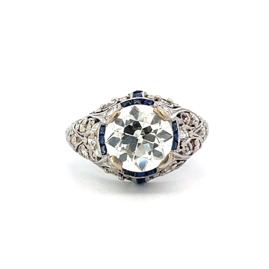 Curel Ring. Antique Art Deco Diamond Engagement Ring, Sapphire Halo, Circa 1925