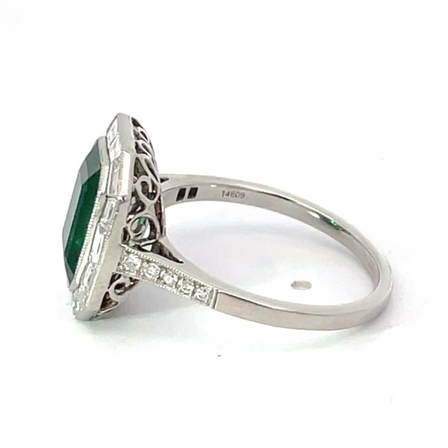 Side view of 2.66ct Emerald Cut Natural Green Emerald Engagement Ring, Diamond Halo, Platinum