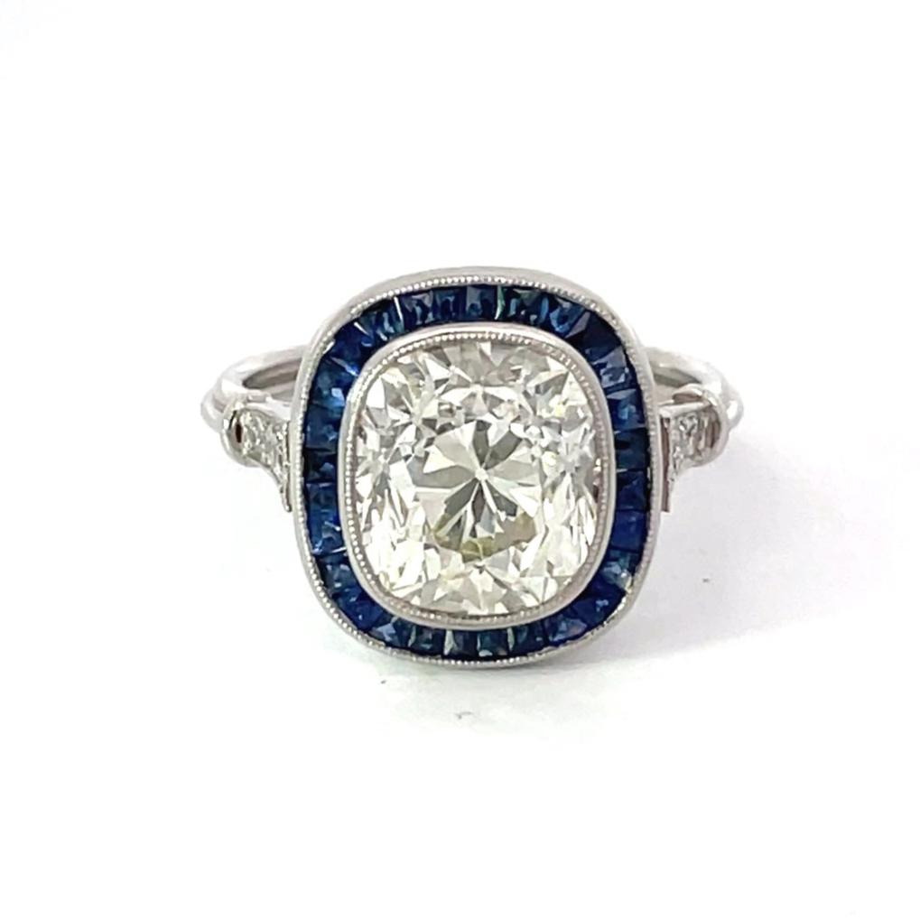 Front view of 4.06ct Antique Cushion Cut Diamond Engagement Ring, Sapphire Halo, Platinum